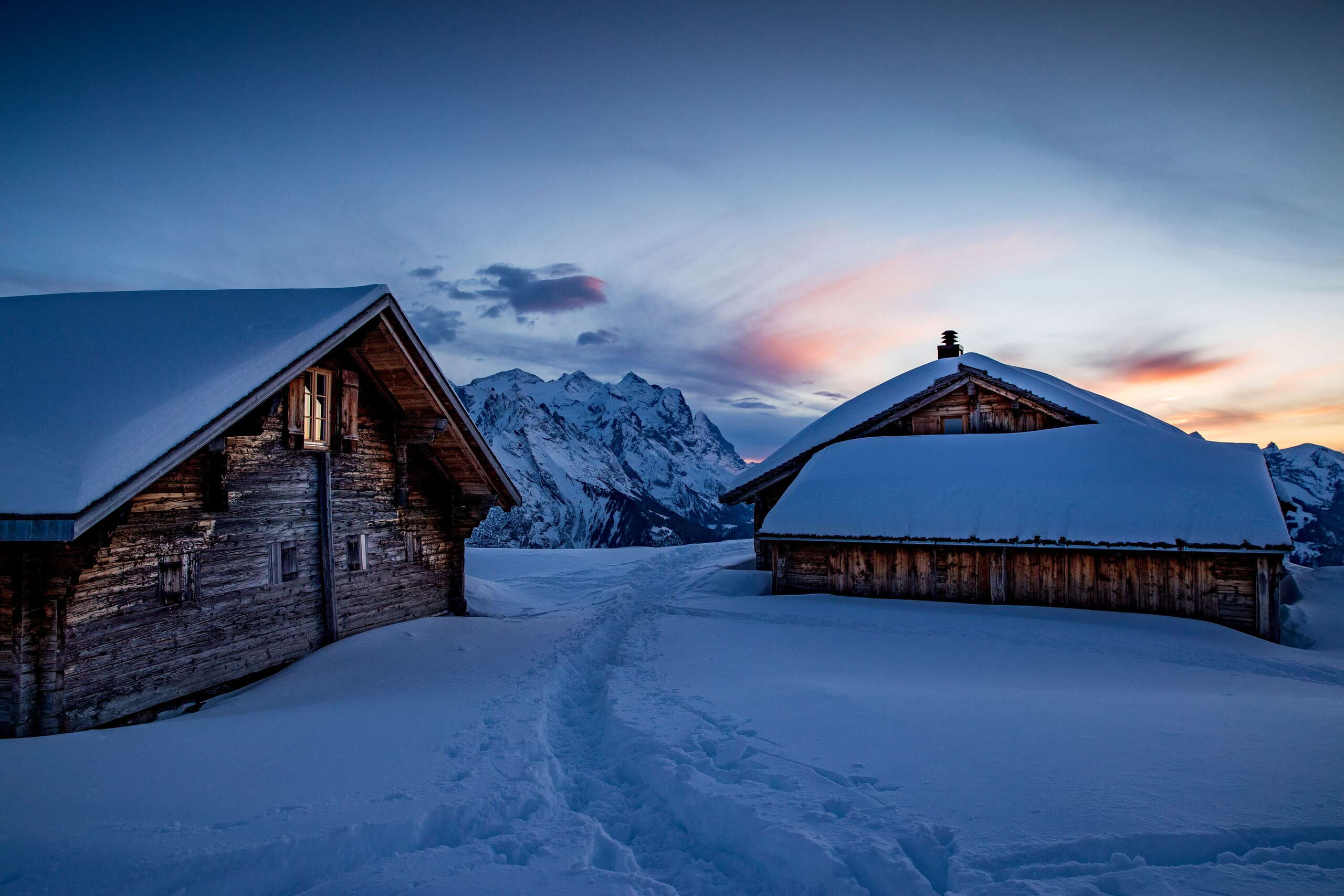 Evening atmosphere: Snow-covered huts on the Hasliberg